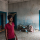 A boy looks in the abandoned house he squats in with his family in Hamam Lif, a suburb just south of Tunis. Skyrocketing prices since the revolution of 2011 have forced families like his to the margins.